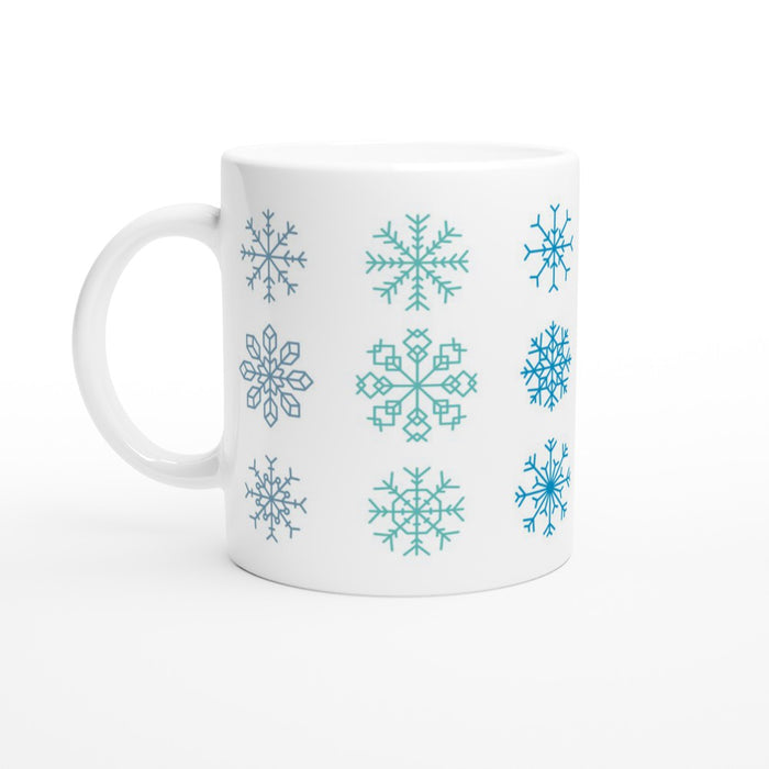 Tasse mit verschiedenen Schneeflocken - blau/grün