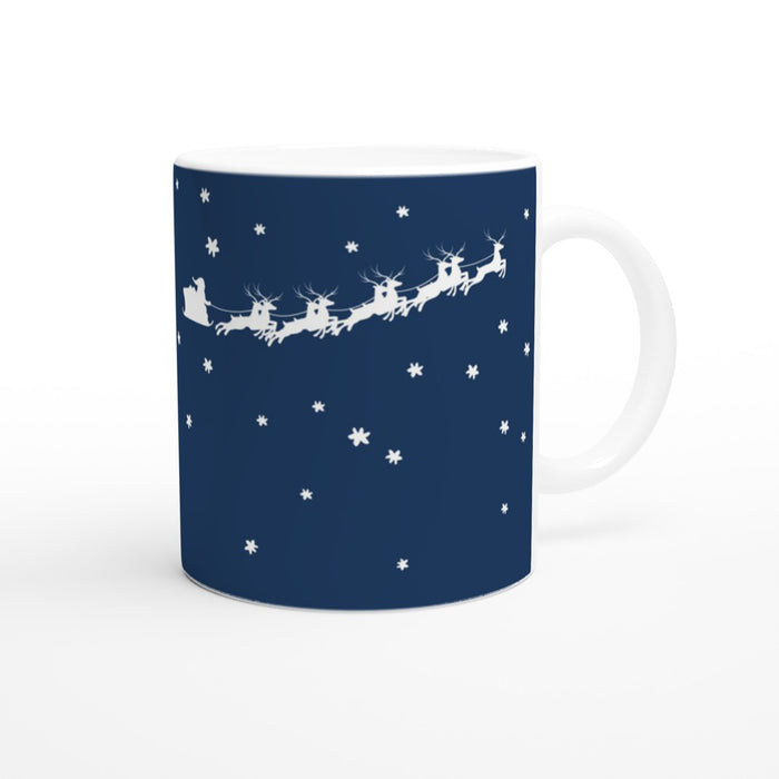 Tasse It's Magic - Weihnachtsmann mit Rentierschlitten im Sternenhimmel